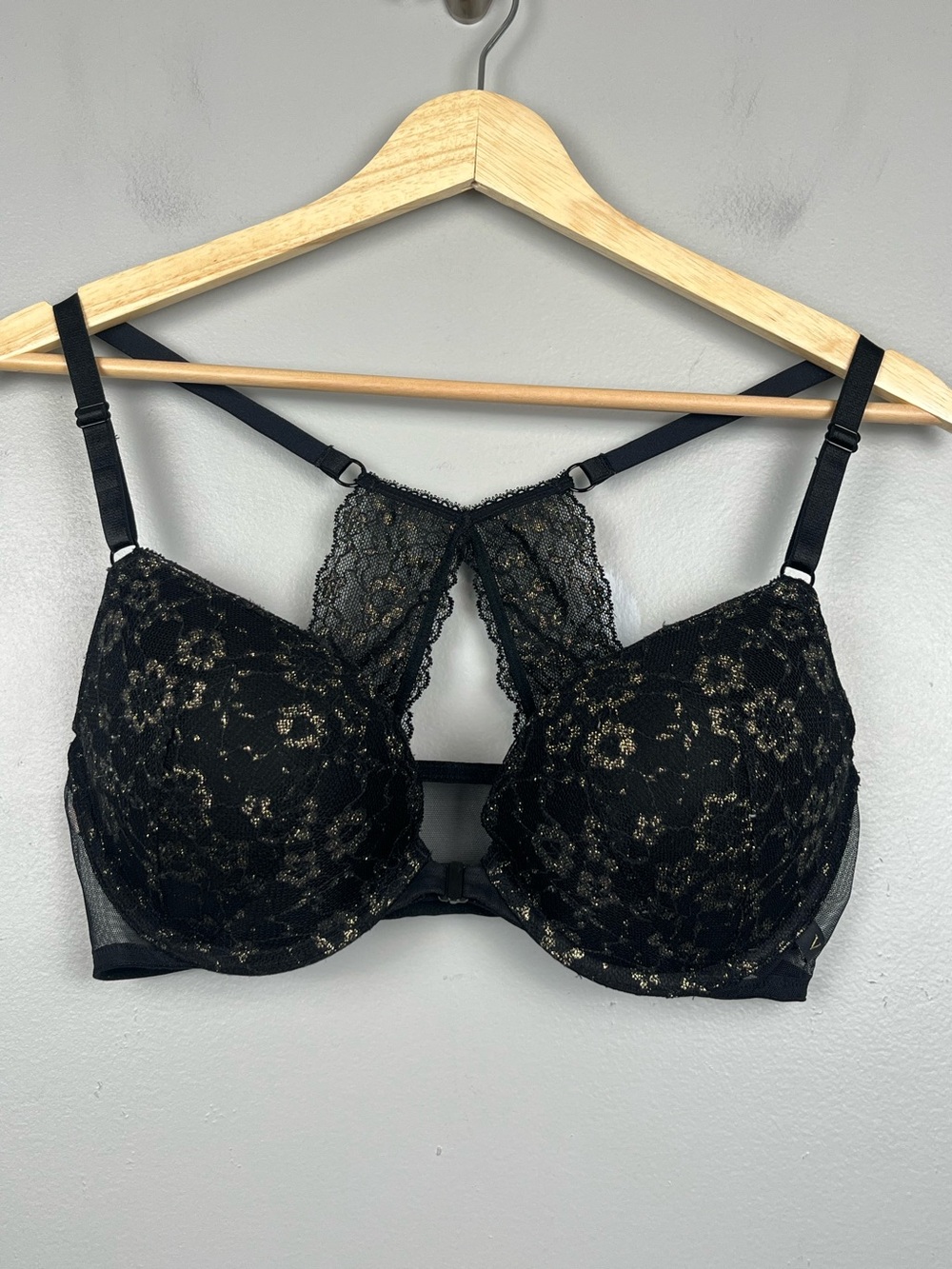 Victoria’s Secret black & metallic gold lace front close push-up bra, 36C.